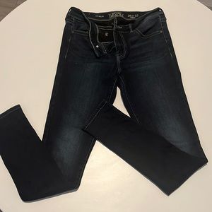 Buckle skinny jeans